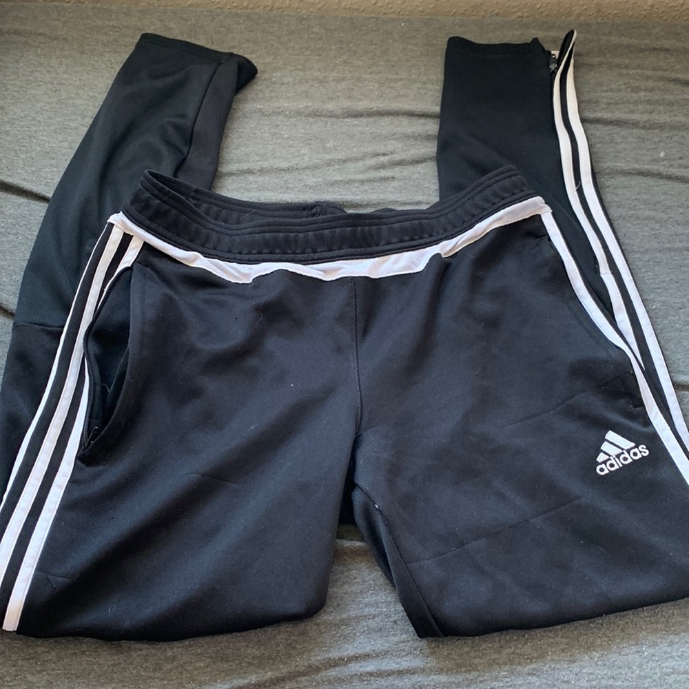 Adidas pants with zippers on the bottom with zipper pockets